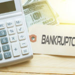 Calculator and bankruptcy sign Calculator and bankruptcy sign