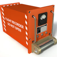 Red airplane black box that say flight recorder do not open Red airplane black box that say flight recorder do not open