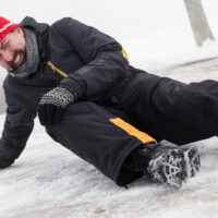 man on floor after slipping and falling