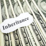 Inheritance note on top of hundred dollar bills Inheritance note on top of hundred dollar bills