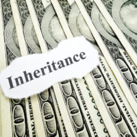 Inheritance note on top of hundred dollar bills Inheritance note on top of hundred dollar bills