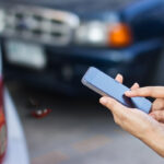 woman using smartphone to call roadside after car accident woman using smartphone to call roadside after car accident