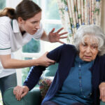 Female worker abusing a older woman Female worker abusing a older woman