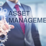 Businessman points at Asset Management caption Businessman points at Asset Management caption