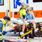 Emergency doctors caring for accident victim boy Emergency doctors caring for accident victim boy