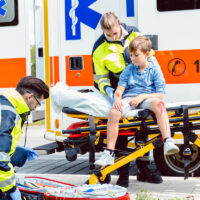 Emergency doctors caring for accident victim boy