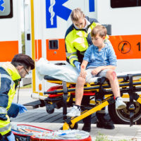 Emergency doctors caring for accident victim boy Emergency doctors caring for accident victim boy