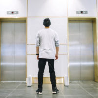 Man in hat waiting for an elevator Man in hat waiting for an elevator