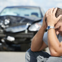 upset man after car crash