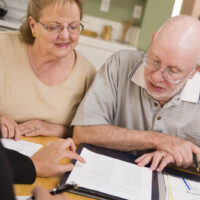 Old couple going over costs