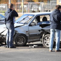 clash of two cars at the crossroads