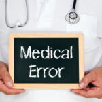 Doctor holding a medical error sign Doctor holding a medical error sign