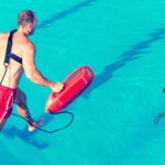 Life guard jumping in a pool Life guard jumping in a pool