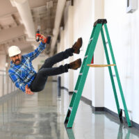 Construction worker falling off the ladder