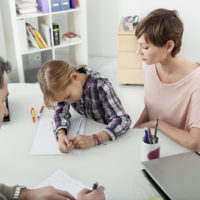Child going through psychological testing Child going through psychological testing