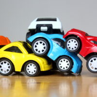 colorful miniature cars show multiple chain reaction car accident