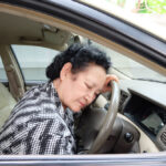 senior-woman-alseep-behind-the-wheel senior-woman-alseep-behind-the-wheel