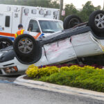 White car rolled over White car rolled over