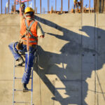 construction worker on ladder construction worker on ladder