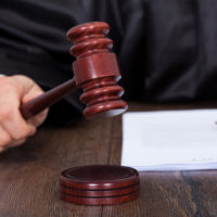 Judge hitting a gavel Judge hitting a gavel