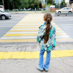 Little girl crossing the street Little girl crossing the street