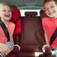 Two kids wearing seat belts Two kids wearing seat belts
