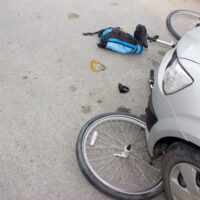 Grey car runs over bike Grey car runs over bike
