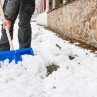 Guy shoveling up snow