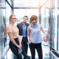 employees inside an Elevator