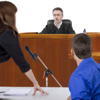 divorce lawyer talking with judge during Courtroom Trial