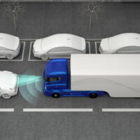 Blue truck stopped by automatic braking system