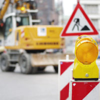Construction site with sign - and still an increase of injuries on worksites according to construction injury statistics Construction site with sign - and still an increase of injuries on worksites according to construction injury statistics