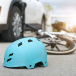 aftermath of bicycle accident with car on road aftermath of bicycle accident with car on road