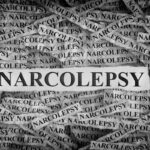 Torn pieces of paper with the words Narcolepsy Torn pieces of paper with the words Narcolepsy