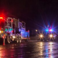 First Responders - firefighters and police officers - on a wet night