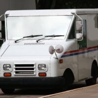 White Mail Truck Delivering Mail