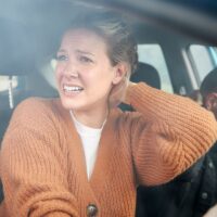 Couple Involved In Car Crash With Female Driver Suffering With Whiplash Injury Couple Involved In Car Crash With Female Driver Suffering With Whiplash Injury