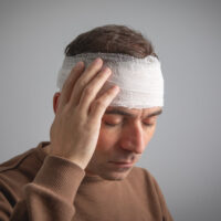 Caucasian man with a bandage on head. Caucasian man with a bandage on head.